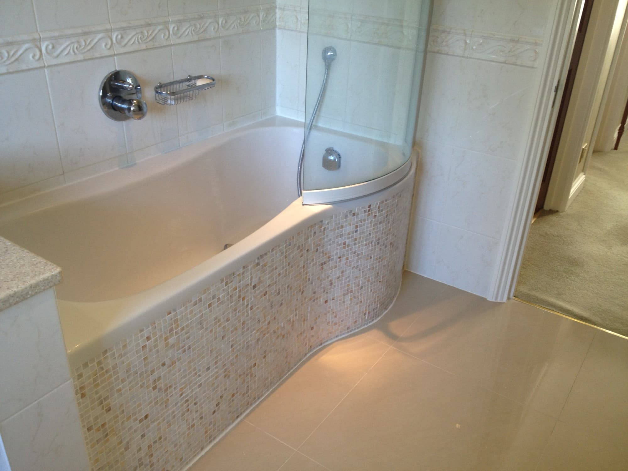 Bathroom renovation by The Snagman — curved bath and shower screen